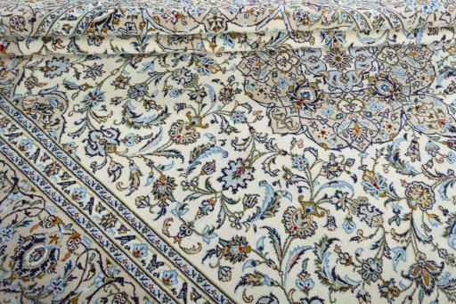 Close-up detail of 2000s Kashan rug from Iran / Persia showing Wool weave