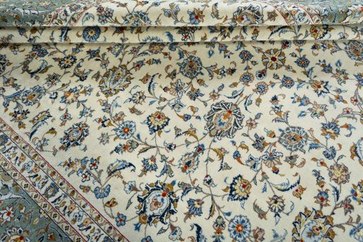 Close-up detail of 2000s Kashan rug from Iran / Persia showing Wool weave