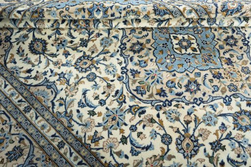 Close-up detail of 2000s Kashan rug from Iran / Persia showing Wool weave