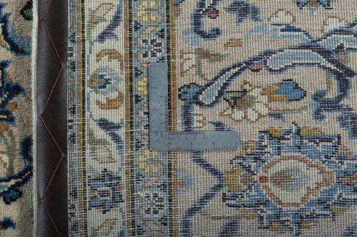 Backside of handmade 2000s Kashan rug showing knot structure and weave density
