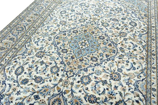 Backside of handmade 2000s Kashan rug showing knot structure and weave density