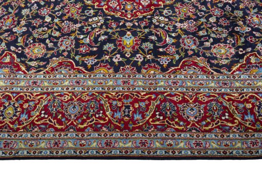 Close-up detail of 2000s Kashan rug from Iran / Persia showing Wool weave