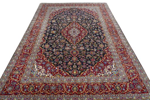 Backside of handmade 2000s Kashan rug showing knot structure and weave density
