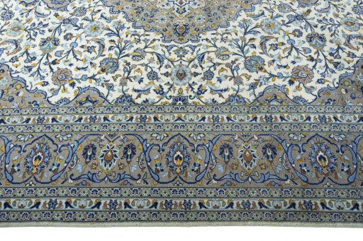Corner detail of 2000s Kashan rug showing border pattern and Cork pile