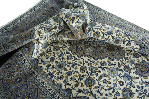 Surface texture of 2000s Kashan rug with natural Cork and intricate pattern