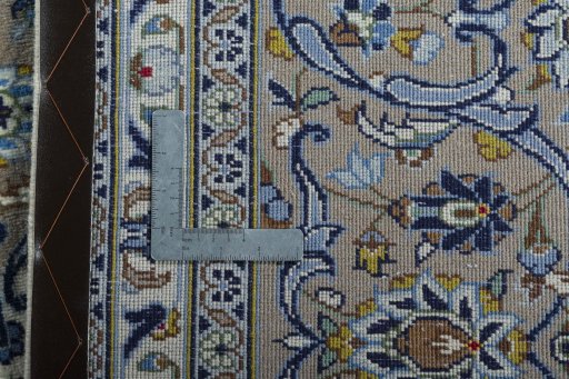 Backside of handmade 2000s Kashan rug showing knot structure and weave density