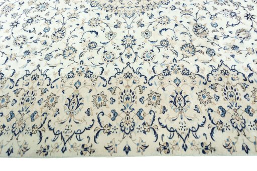 Corner detail of 2000s Kashan rug showing border pattern and Wool pile