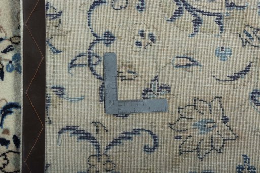Backside of handmade 2000s Kashan rug showing knot structure and weave density