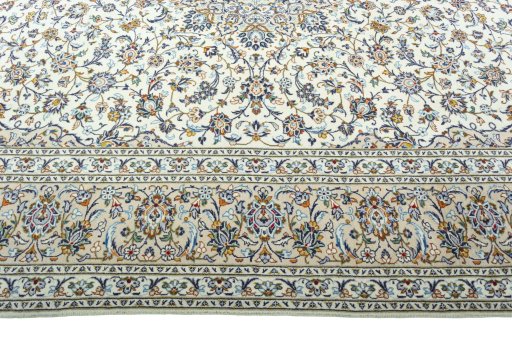 Corner detail of 2000s Kashan rug showing border pattern and Wool pile