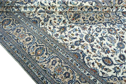 Close-up detail of 2000s Kashan rug from Iran / Persia showing Wool weave