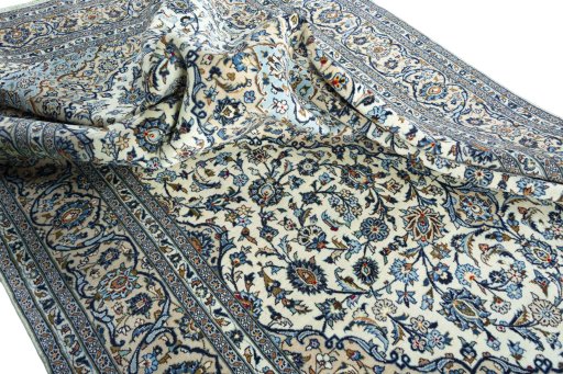 Surface texture of 2000s Kashan rug with natural Wool and intricate pattern