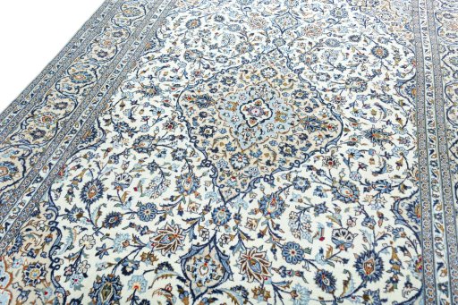 Backside of handmade 2000s Kashan rug showing knot structure and weave density