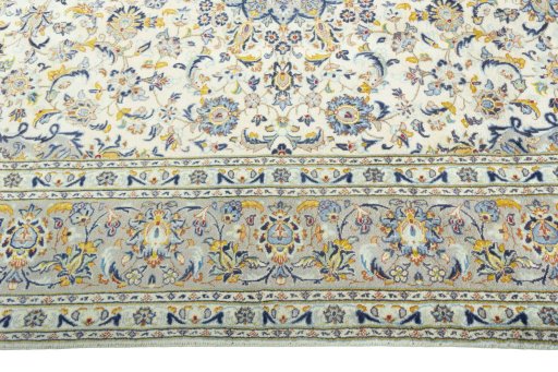 Corner detail of 2000s Kashan rug showing border pattern and Wool pile