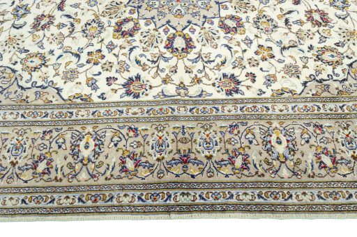 Corner detail of 2000s Kashan rug showing border pattern and Wool pile
