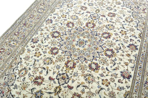 Backside of handmade 2000s Kashan rug showing knot structure and weave density