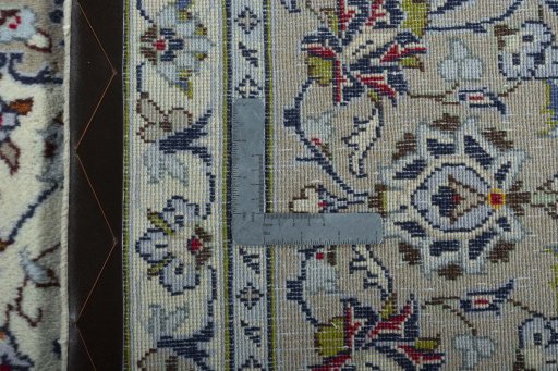 Backside of handmade 2000s Kashan rug showing knot structure and weave density