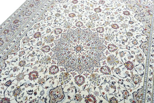 Backside of handmade 2000s Kashan rug showing knot structure and weave density