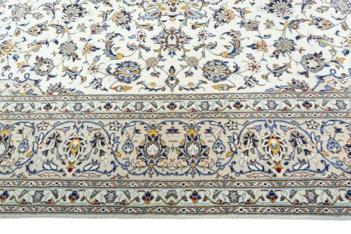 Corner detail of 2000s Kashan rug showing border pattern and Wool pile