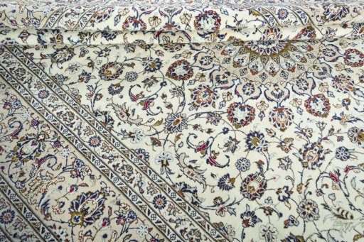 Close-up detail of 2000s Kashan rug from Iran / Persia showing Wool weave