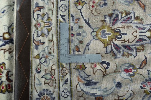 Backside of handmade 2000s Kashan rug showing knot structure and weave density