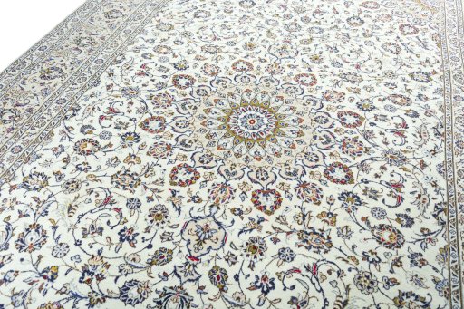 Backside of handmade 2000s Kashan rug showing knot structure and weave density