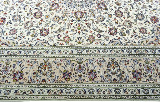 Corner detail of 2000s Kashan rug showing border pattern and Wool pile