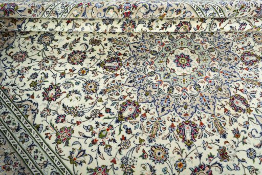 Close-up detail of 2000s Kashan rug from Iran / Persia showing Wool weave