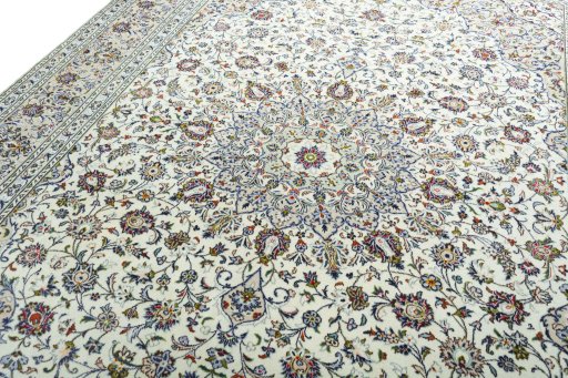 Backside of handmade 2000s Kashan rug showing knot structure and weave density