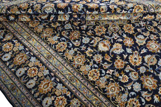 Close-up detail of 2000s Kashan rug from Iran / Persia showing Wool weave