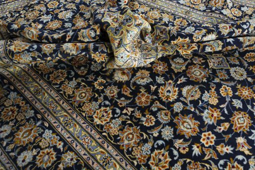 Surface texture of 2000s Kashan rug with natural Wool and intricate pattern