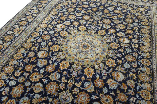 Backside of handmade 2000s Kashan rug showing knot structure and weave density