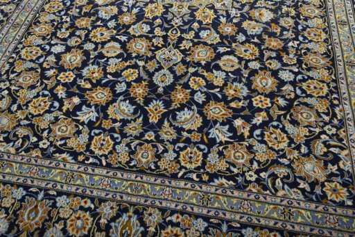 Close-up detail of 2000s Kashan rug from Iran / Persia showing Wool weave