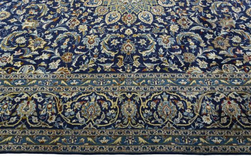 Corner detail of 2000s Kashan rug showing border pattern and Wool pile