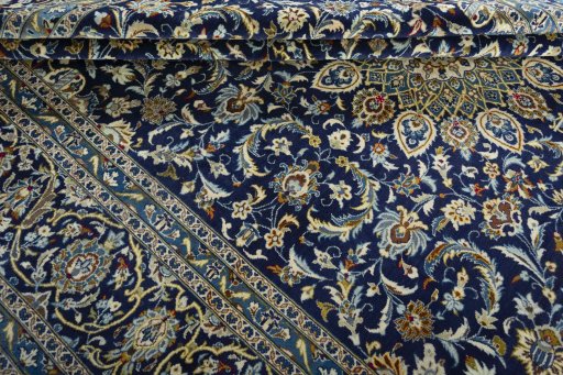 Close-up detail of 2000s Kashan rug from Iran / Persia showing Wool weave