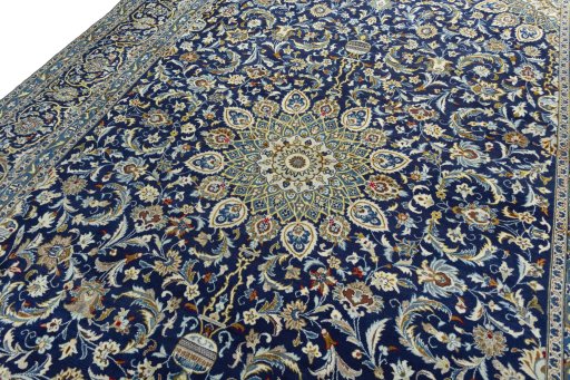 Backside of handmade 2000s Kashan rug showing knot structure and weave density
