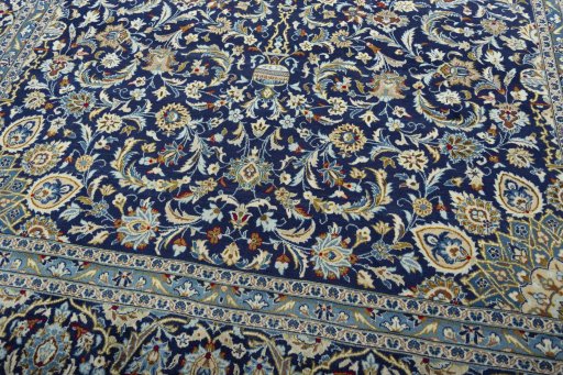 Close-up detail of 2000s Kashan rug from Iran / Persia showing Wool weave