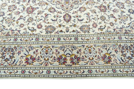 Corner detail of 2000s Kashan rug showing border pattern and Wool pile