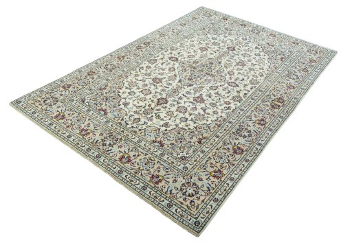 Corner detail of 2000s Kashan rug showing border pattern and Wool pile