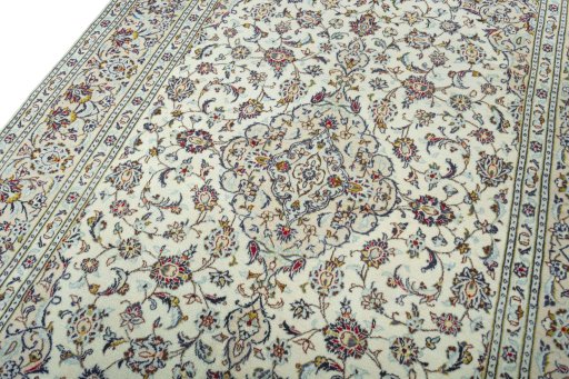 Backside of handmade 2000s Kashan rug showing knot structure and weave density