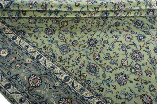 Close-up detail of 2000s Kashan rug from Iran / Persia showing Wool weave