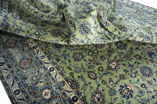 Surface texture of 2000s Kashan rug with natural Wool and intricate pattern