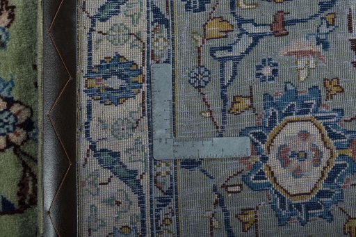 Backside of handmade 2000s Kashan rug showing knot structure and weave density
