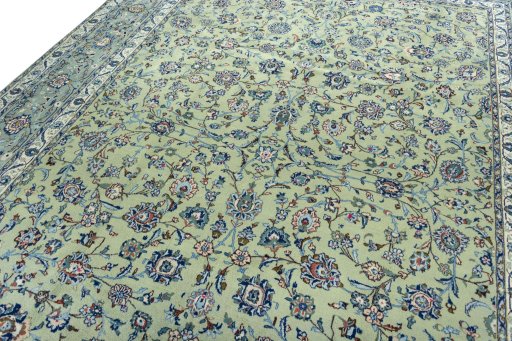 Backside of handmade 2000s Kashan rug showing knot structure and weave density
