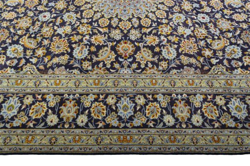 Corner detail of 2000s Kashan rug showing border pattern and Wool pile
