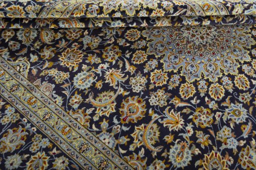 Close-up detail of 2000s Kashan rug from Iran / Persia showing Wool weave