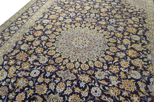 Backside of handmade 2000s Kashan rug showing knot structure and weave density
