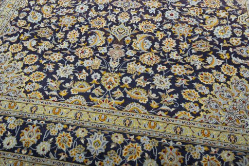 Close-up detail of 2000s Kashan rug from Iran / Persia showing Wool weave