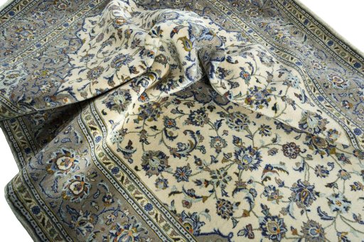 Surface texture of 2000s Kashan rug with natural Wool and intricate pattern