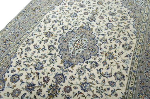 Backside of handmade 2000s Kashan rug showing knot structure and weave density