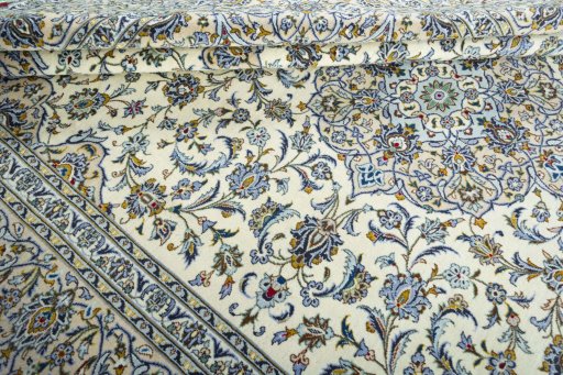 Close-up detail of 2000s Kashan rug from Iran / Persia showing Wool weave